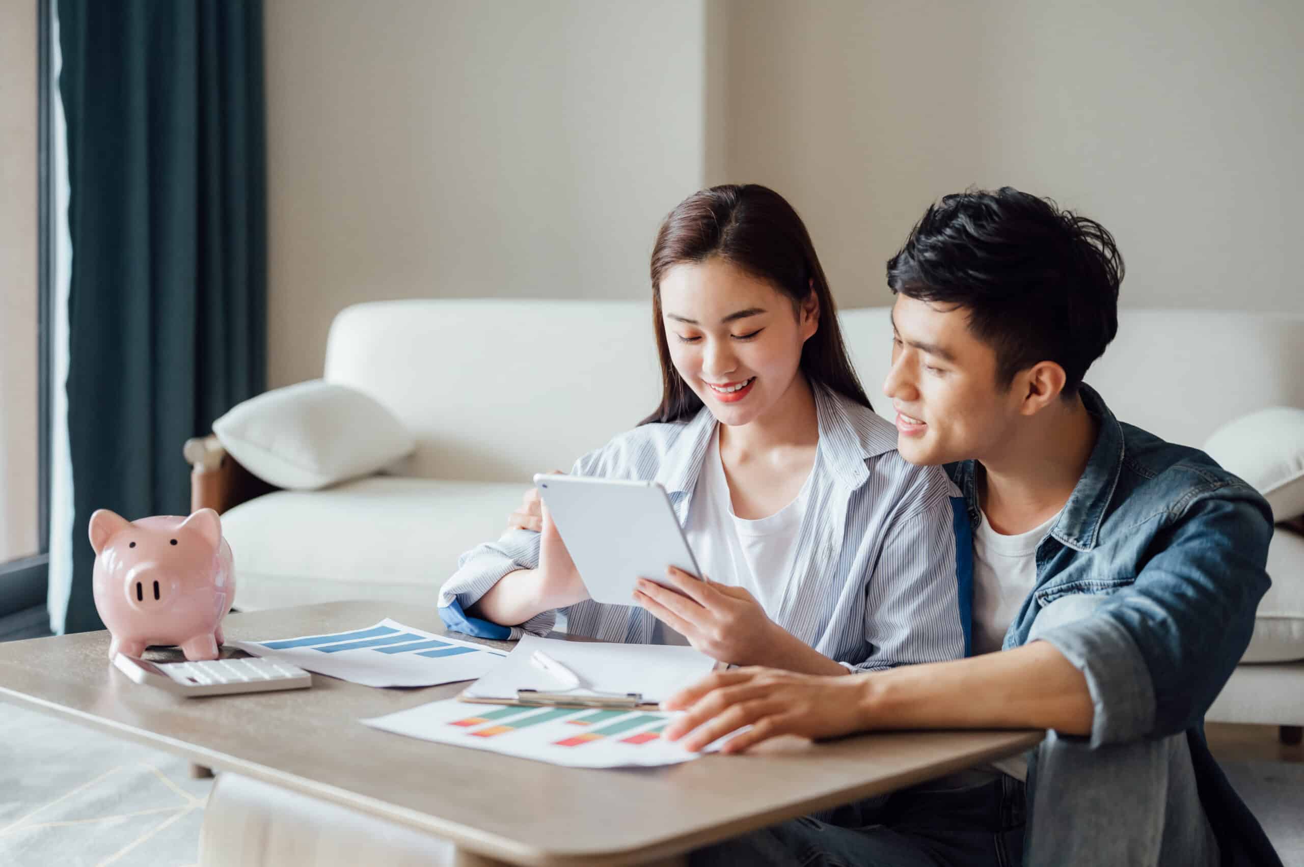 Young couple working together at home